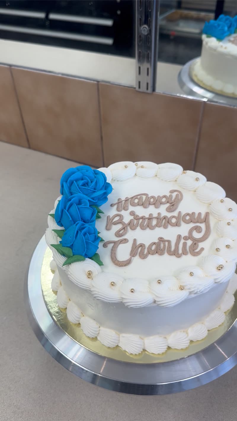 Birthday cake with blue buttercream roses