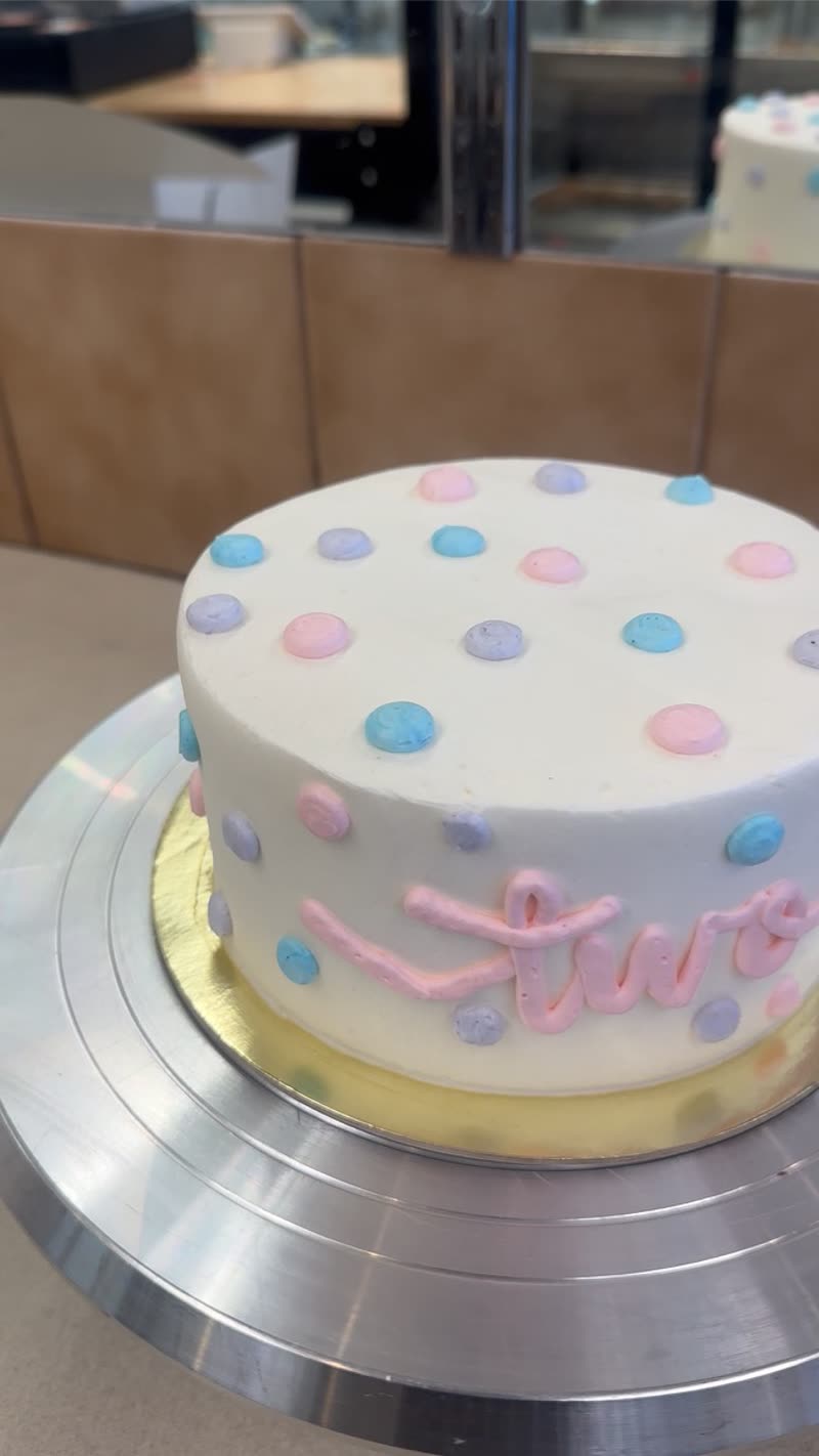 Pastel polka dot first birthday cake