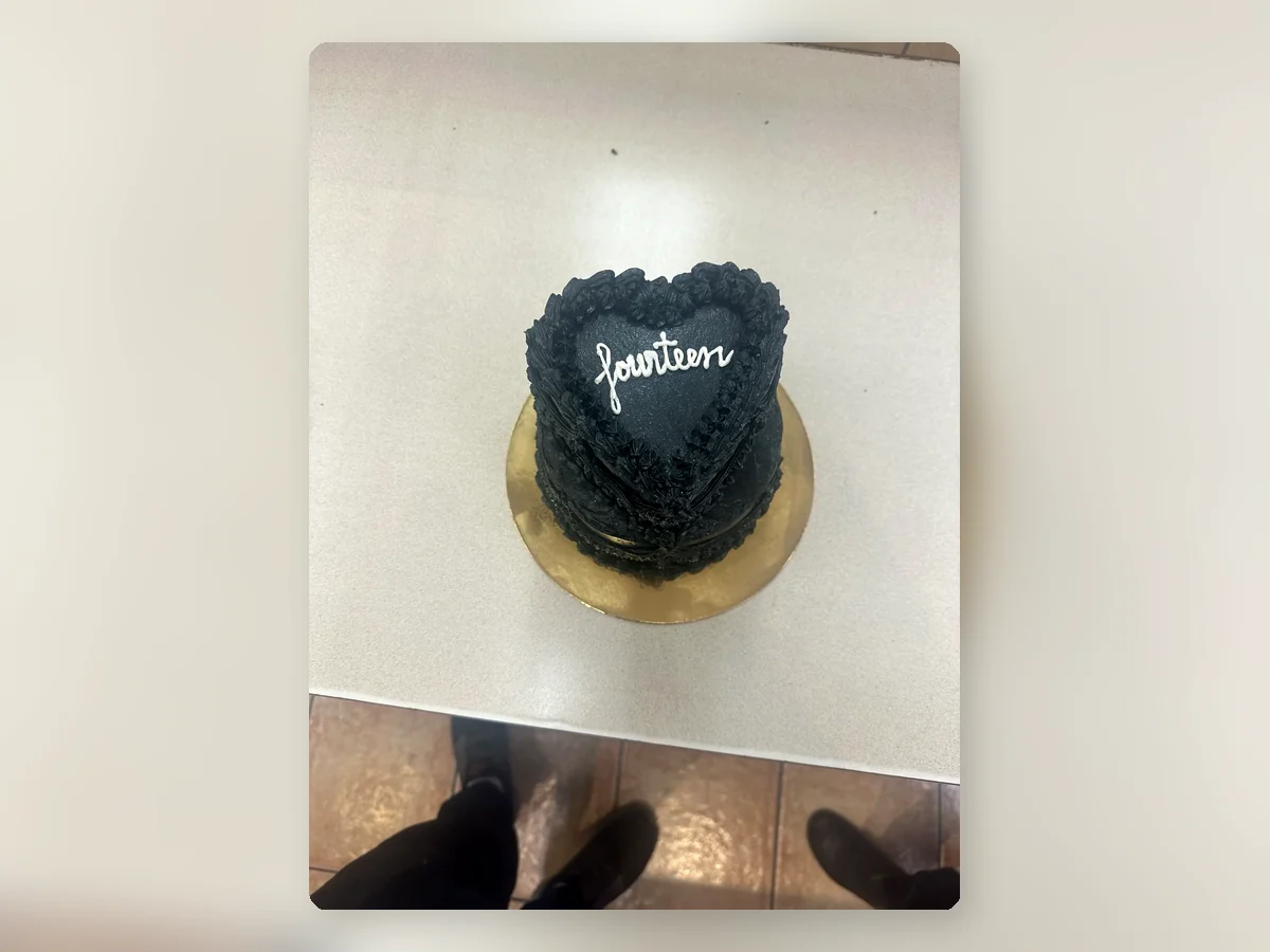 Black heart-shaped vintage cake by Richlea Bakery