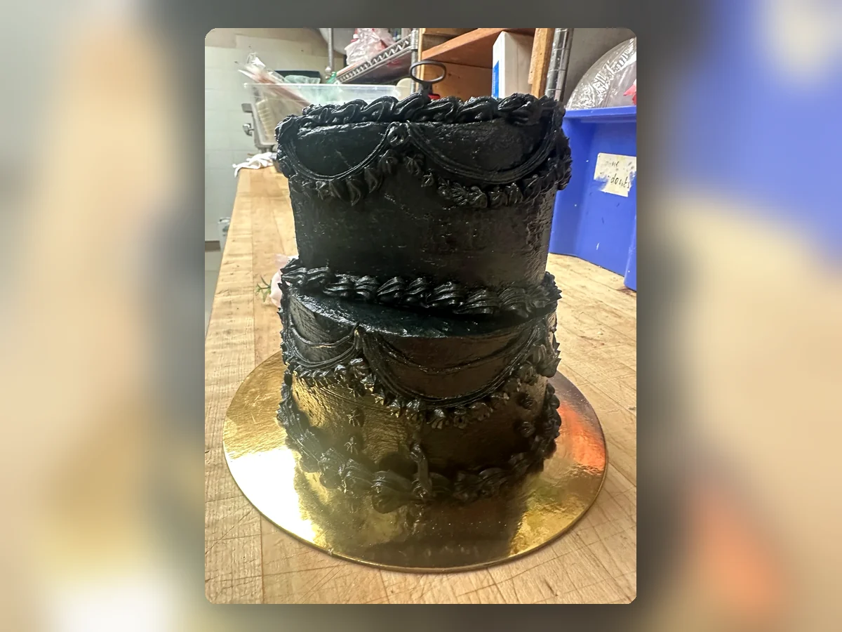 Black vintage-style tiered cake by Richlea Bakery