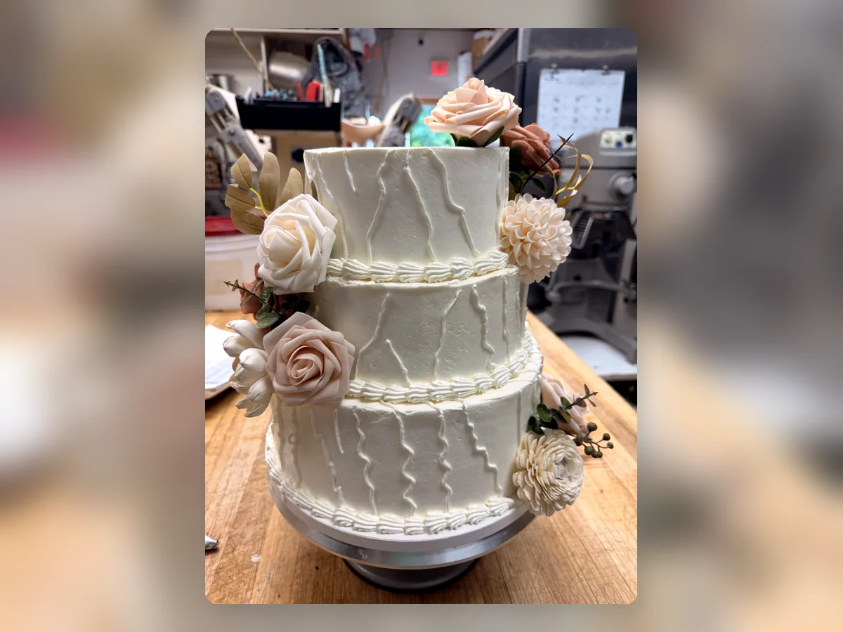 Three-tier floral celebration cake, alternate view by Richlea Bakery