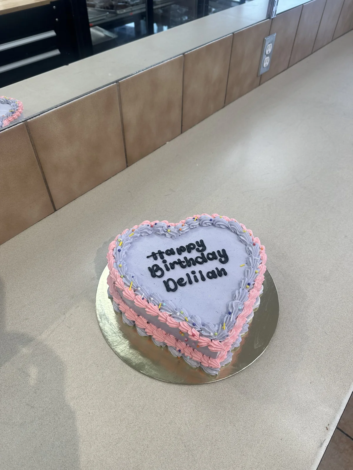 Pink and blue heart-shaped celebration cake