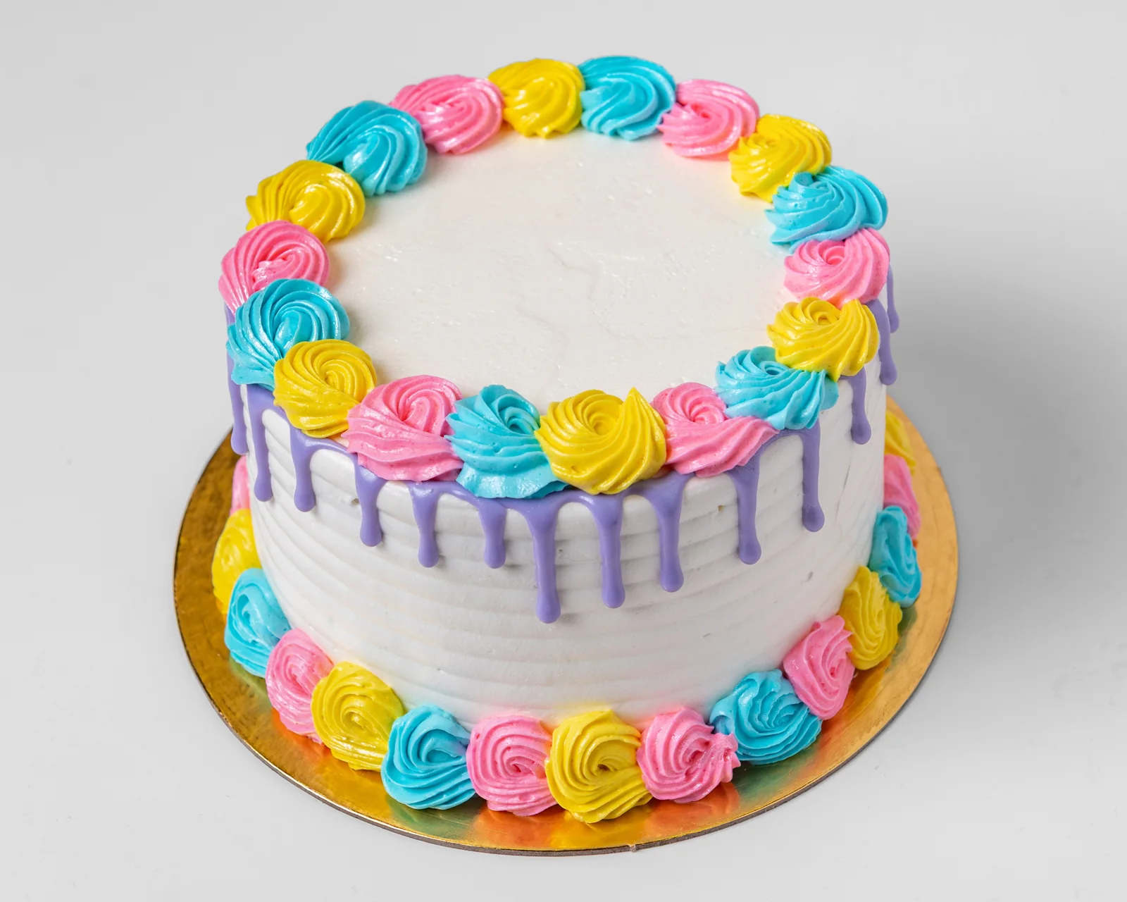 Colourful buttercream celebration cake with piped border