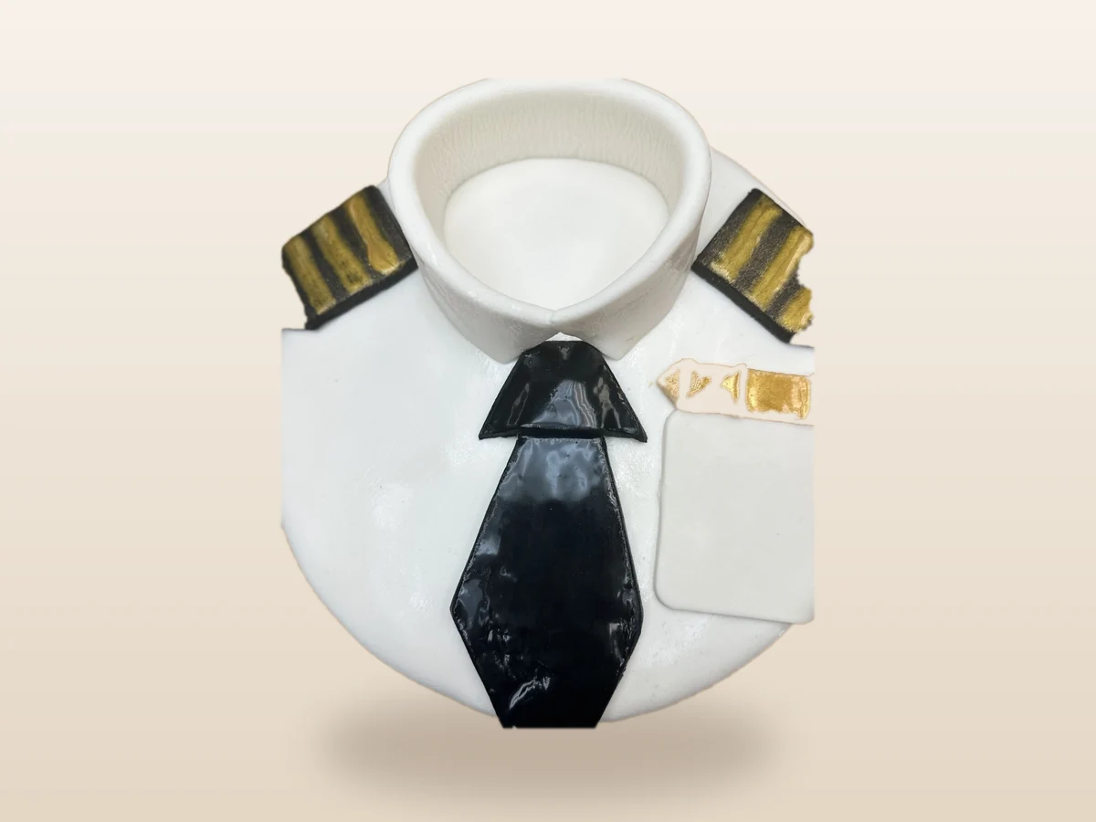 Custom white cake designed as a dress shirt with black tie and gold details