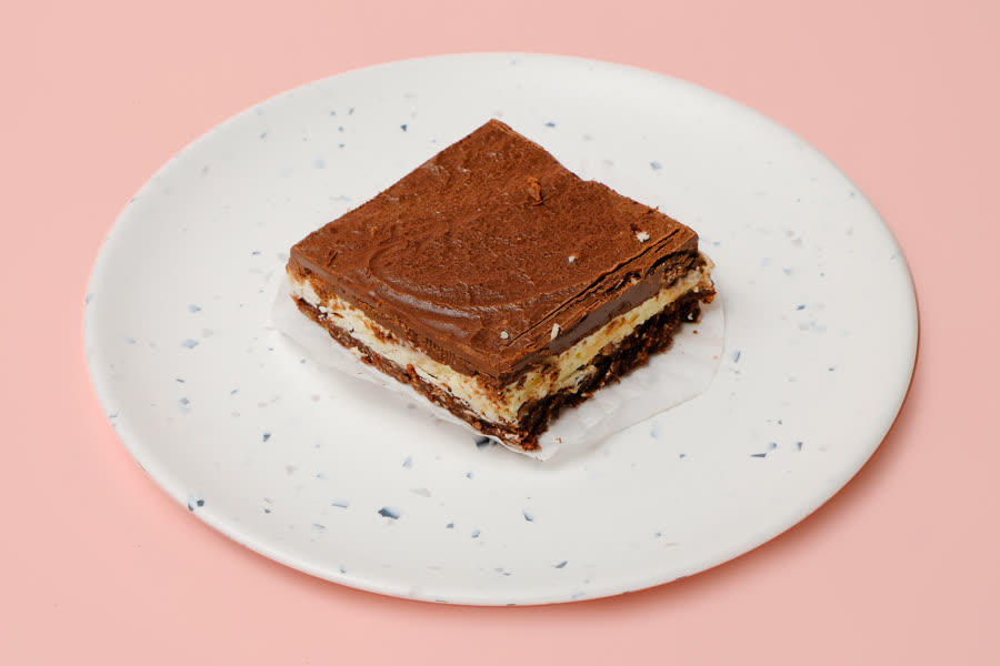 Nanaimo bar with coconut base and chocolate top